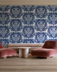 Serene Blossom Indigo damask wallpaper in a boutique hotel sitting area