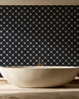 Shadow Garden Onyx lattice floral wallpaper creating ambiance in a serene spa bathroom