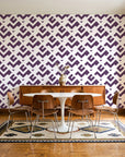 Signal & Edge Plum geometric wallpaper in a mid-century dining room with a teak sideboard and tulip table