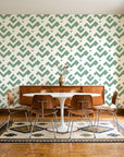 Signal & Edge Sage geometric wallpaper in a mid-century dining room with a teak sideboard and tulip table