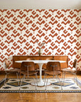 Signal & Edge Terracotta geometric wallpaper in a mid-century dining room with a teak sideboard and tulip table