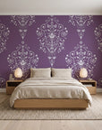 Silent Spring Plum damask wallpaper behind a low platform bed in a serene Japandi bedroom