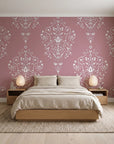 Silent Spring Rose damask wallpaper behind a low platform bed in a serene Japandi bedroom