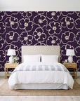 Sketch Anemone Aubergine sketched anemone wallpaper behind a queen bed in a bright coastal bedroom