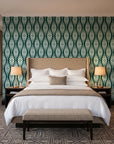 Smoke Ancestry Forest geometric wallpaper behind the headboard of a king bed in a contemporary hotel guest room