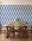 Smoke Ancestry Indigo geometric wallpaper in a farmhouse dining room with a sage sideboard and rustic trestle table