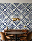 Soft Bouquet Opus Midnight floral damask wallpaper behind a walnut credenza and round table in an elegant dining room