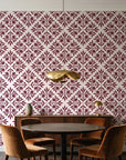 Soft Bouquet Opus Oxblood floral damask wallpaper behind a walnut credenza and round table in an elegant dining room