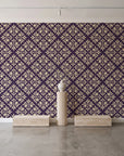 Soft Bouquet Opus Plum floral damask wallpaper behind a travertine pedestal and vase in a minimal boutique
