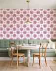 Solstice Bloom Berry folk sun wallpaper as a feature wall in a sunlit breakfast nook