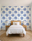Solstice Bloom Cobalt folk sun wallpaper in a bright, cheerful child's bedroom