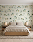 Solstice Rite Forest boho rainbow wallpaper behind a low platform bed in a serene Japandi bedroom