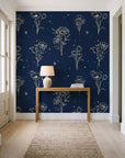 Star & Petal Midnight wildflower line art wallpaper behind a console table in a light entry hallway
