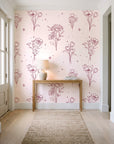 Star & Petal Rose wildflower line art wallpaper behind a console table in a light entry hallway