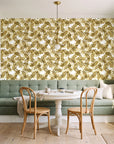Still Morning Ochre foliage wallpaper as a feature wall in a sunlit breakfast nook