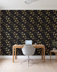 Stone Garden Noir sprig wallpaper behind a modern oak desk in a bright home office
