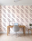 Stone Garden Oxblood sprig wallpaper behind a modern oak desk in a bright home office
