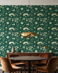 Sun & Moon Emerald celestial folk wallpaper behind a walnut credenza and round table in an elegant dining room