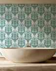 Sunlit Thicket Emerald damask wallpaper creating ambiance in a serene spa bathroom