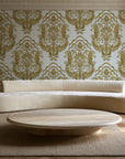 Sunlit Thicket Ochre damask wallpaper in an elegant living room