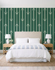 Tranquility Tapestry Emerald art deco stripe wallpaper behind a queen bed in a bright coastal bedroom