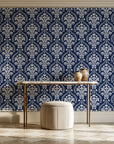 Veiled Botany Navy damask wallpaper on the wall of a grand entry foyer
