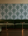 Veiled Botany Sage damask wallpaper in an intimate luxury cocktail lounge