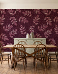 Verdant Scatter Oxblood tossed leaf wallpaper in a farmhouse dining room with a sage sideboard and rustic trestle table