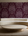 Vintage Eden Oxblood damask wallpaper in an elegant living room