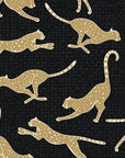 Wild Stride Noir cheetah wallpaper in black and gold