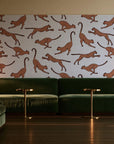 Wild Stride Terracotta cheetah wallpaper in an intimate luxury cocktail lounge