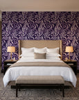 Willow Trace Plum willow vine wallpaper behind the headboard of a king bed in a contemporary hotel guest room