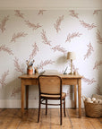 Willow Whisper Terracotta willow sprig wallpaper behind a vintage writing desk in a cozy craft-room home office