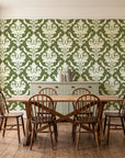 Woodland Blossom Veil Olive damask wallpaper in a farmhouse dining room with a sage sideboard and rustic trestle table