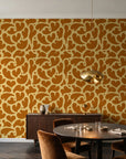 Woven Whisper Marigold abstract heart wallpaper in an elegant dining room