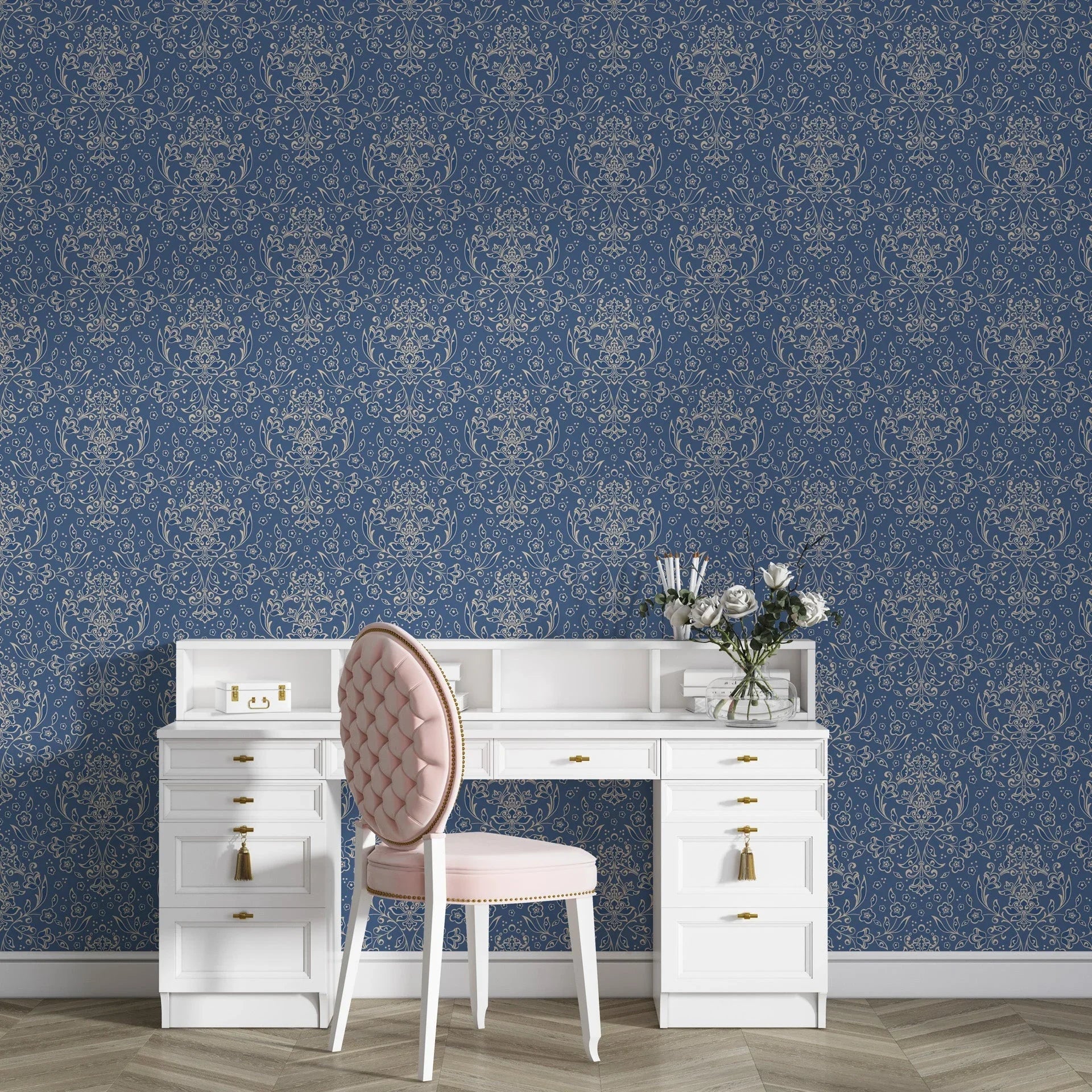 Navy blue and gold Afternoon Arbor damask wallpaper with ornate scrollwork behind white vanity desk