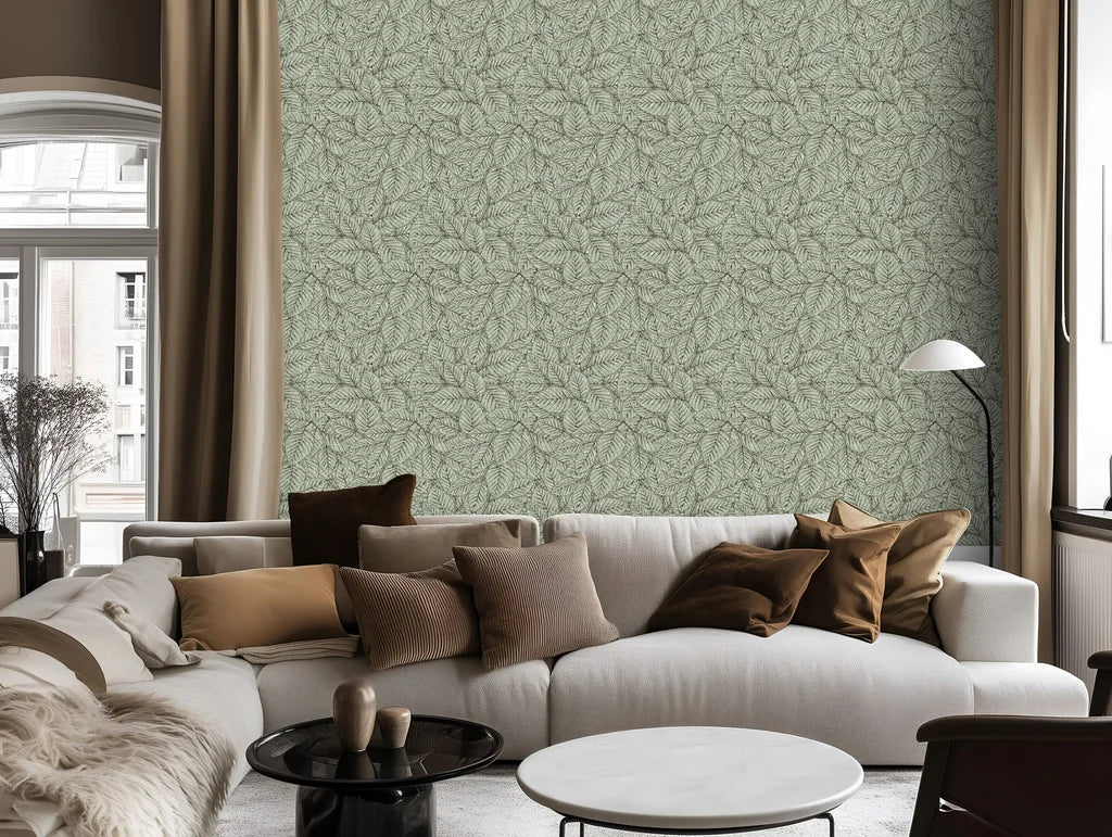 Patterned wall treatment behind a white couch accessorized with accent pillows in the living space.