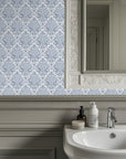 Cool blue damask wallpaper for an inviting and traditional interior.