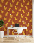 Amber Glimmer Terracotta Leopard Print Wallpaper as a feature wall in a bright home office