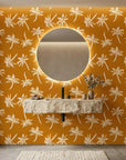 Amber Palms retro palm wallpaper creating ambiance in a serene bathroom
