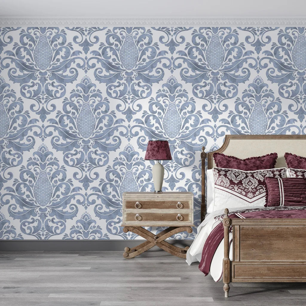Blue and white Amber Blossom Ballet damask wallpaper in elegant bedroom with ornate scrollwork pattern