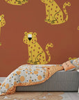 Removable wallpaper featuring a seamless tawny and gold predatory feline pattern with a matte finish. - Amber Glimmer