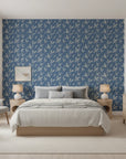 Amber Hour blue botanical leaf wallpaper adding character to a cozy bedroom