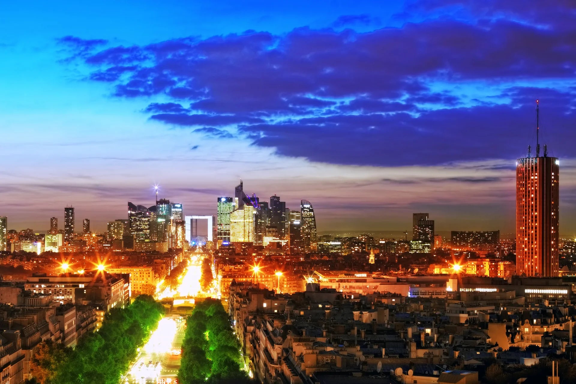 Dramatic Ancient & Modern wallpaper featuring Paris skyline at dusk with illuminated buildings and purple storm clouds