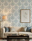 Antique Fern Mist sage green distressed damask wallpaper in a warm and inviting living room