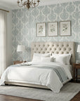 Antique Fern Mist sage green distressed damask wallpaper adding character to a cozy bedroom