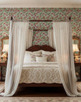 Antique Petal Wash burgundy vintage floral wallpaper adding character to a cozy bedroom