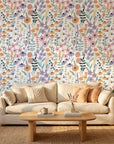 Apricot Meadow pastel floral peel and stick wallpaper as a feature wall in a bright home office
