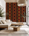 Self-adhesive wall covering featuring a geometric tribal pattern in red and black hues—Southwestern style