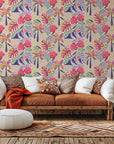 A vibrant wall covering of a tropical landscape, complete with palm trees and striking pink hibiscus flowers (Azure Aloha)